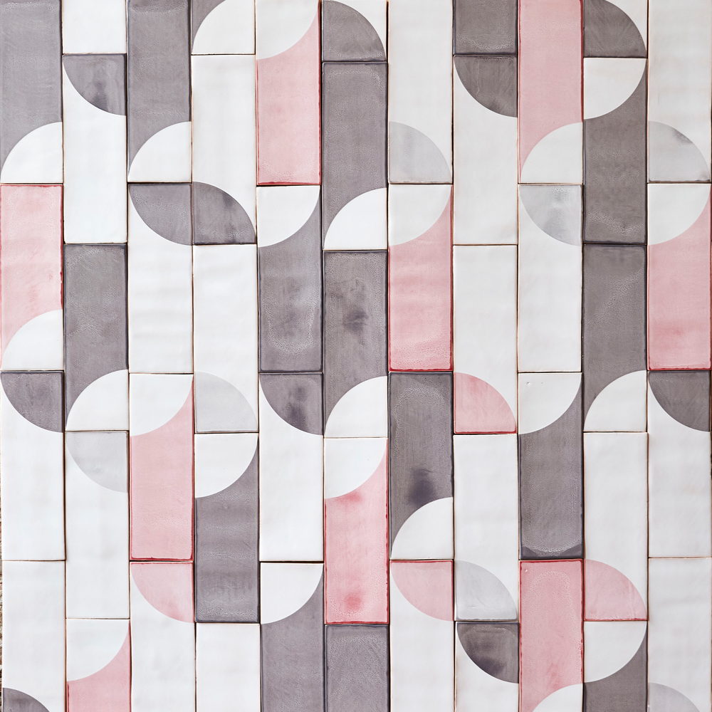 Smink Studio handmade ceramic tiles in white, grey and pink arranged in a half-circle geometric pattern with screen-printed colours.